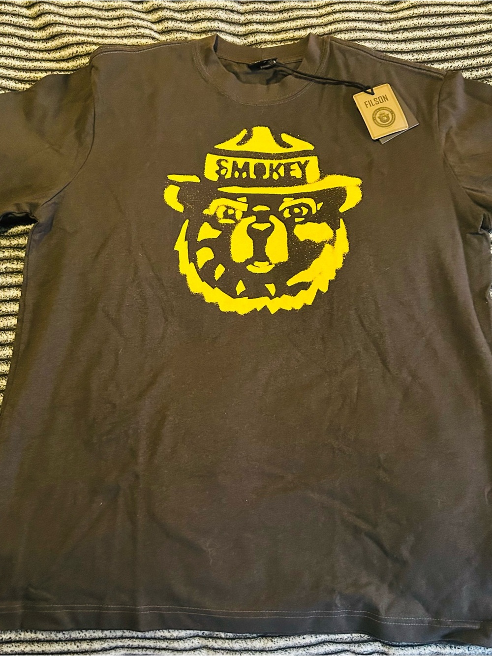 Filson Short Sleeve Tee with Yellow Smokey Bear Graphic on Black